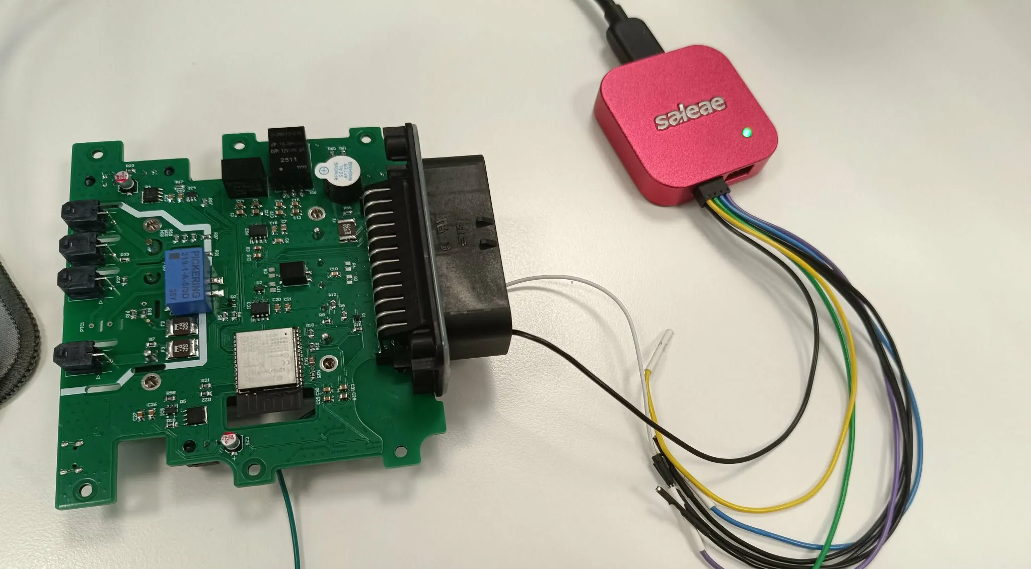 BMS PCB connected to a Saleae logic analyzer during bench testing